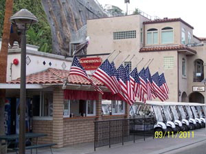 catalina island golf cart rentals fron Island Rentals View as You Walk into town from the Boat Dock  in Avalon on Catalina Island  NOTE the flags are at half staff to commemorate 9/11/2001  pictur taken 9/11/2011 